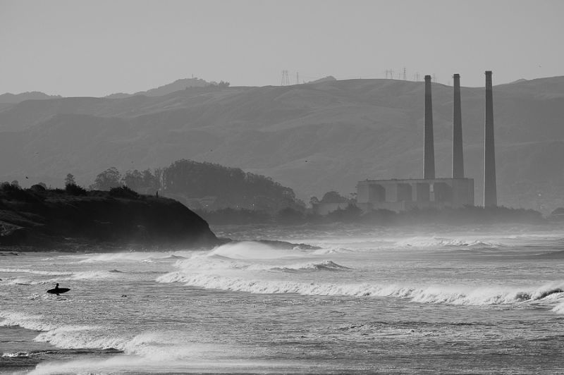 Lifestyle Scenic Surfer walking pat power plant to surf
