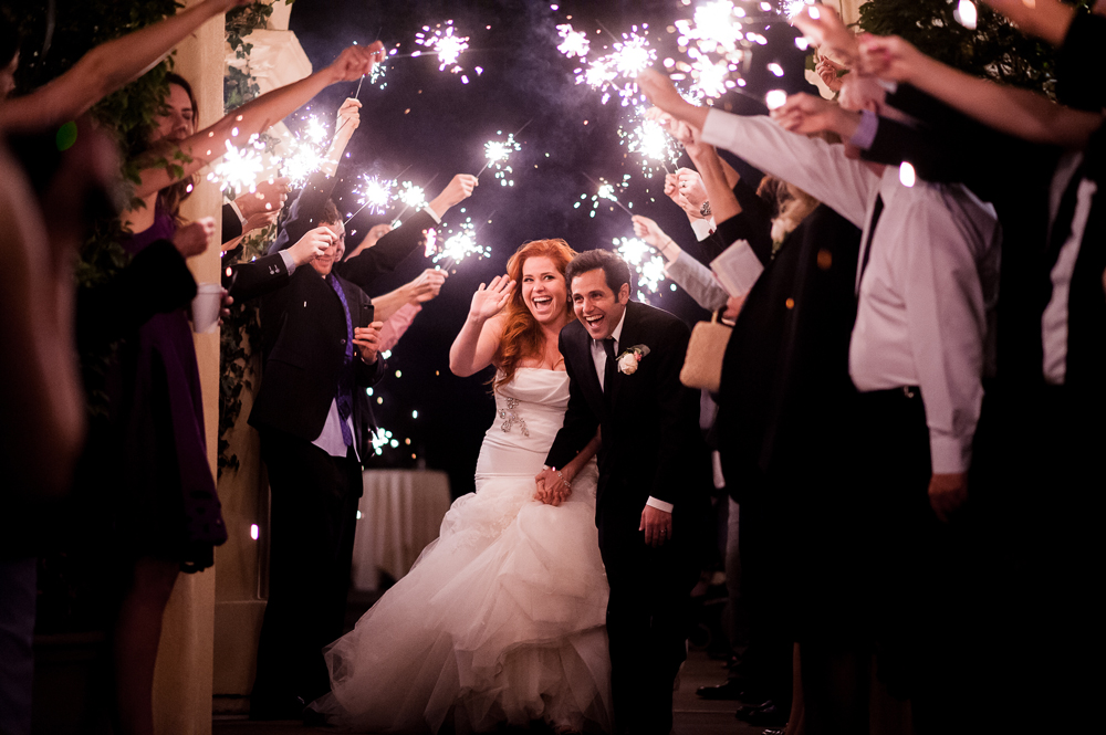 couple dodges sparks in sparkler photos