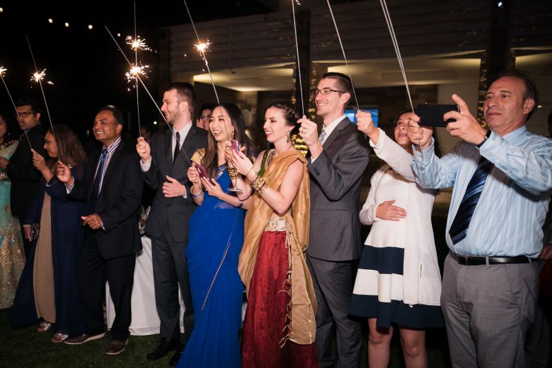 family holds sparklers for wedding sparkler photos