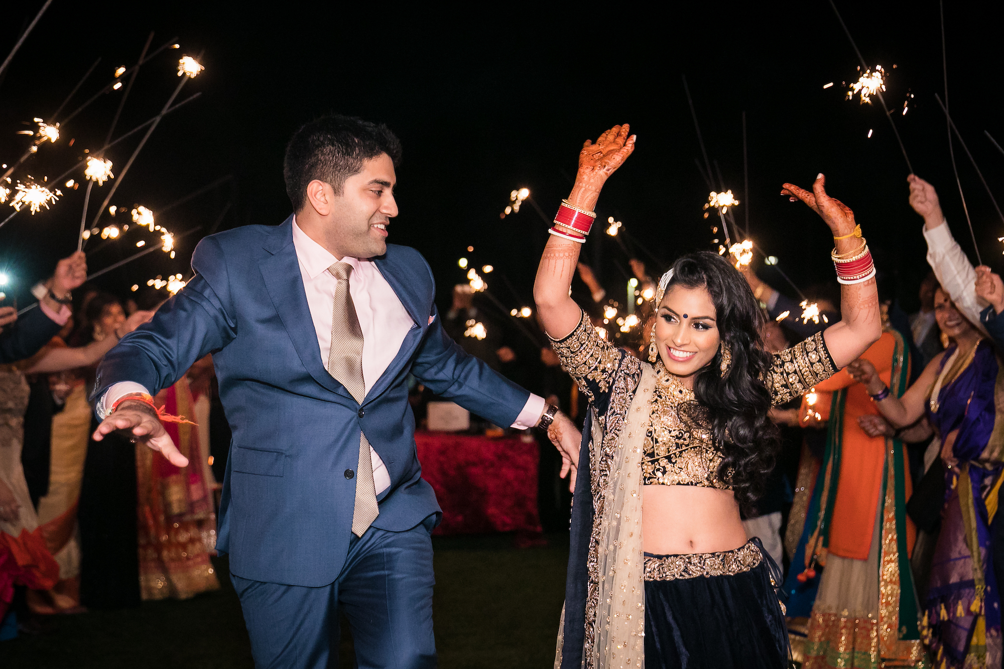 couple exits wedding reception