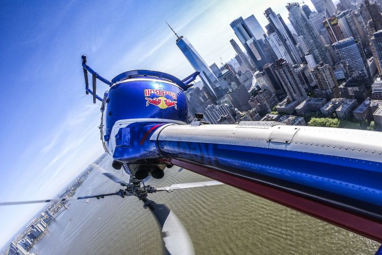 Red Bull Aerobatic Helicopter Pilot, Aaron Fitzgerald, performs flips, barrel rolls and nose dives over the New York City skyline during the morning hours on May 18th 2019.