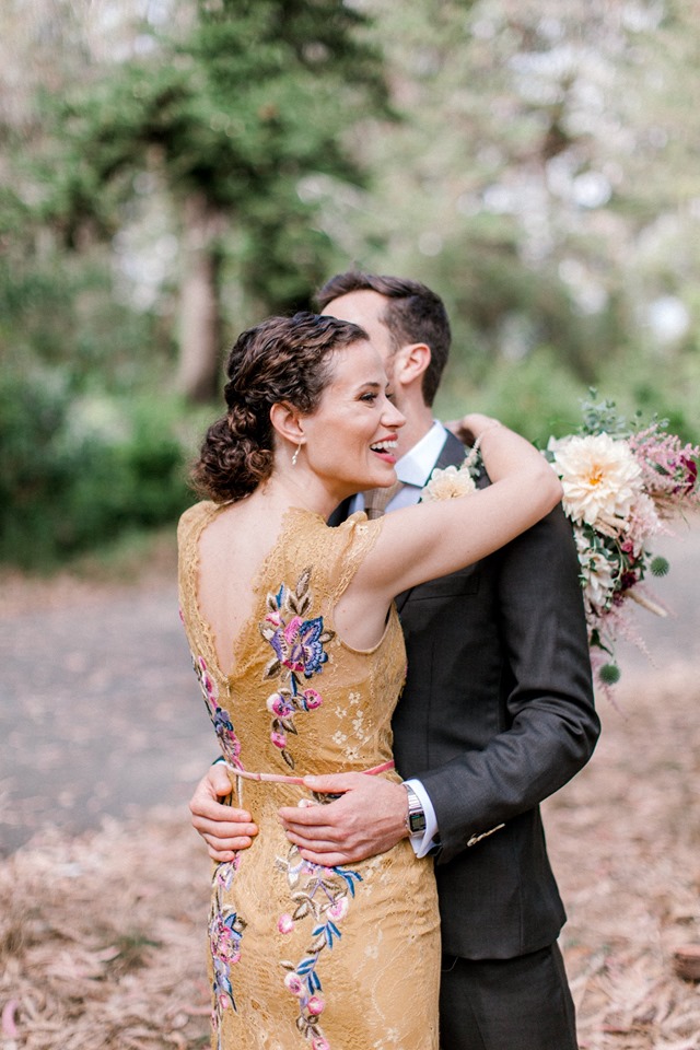 newlyweds hug during portrait session in Golden Gate Park