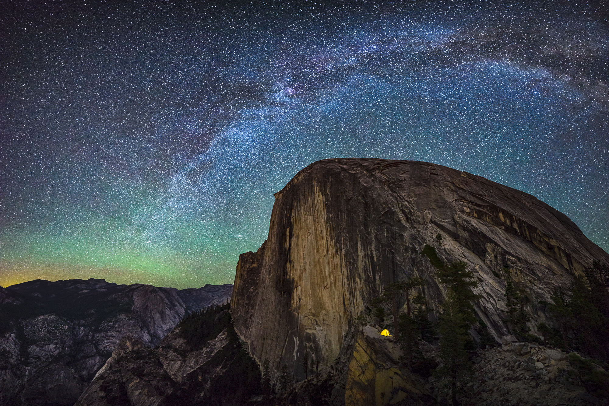 Milky Way arching over Half Dome in Yosemite National Park on a clear night