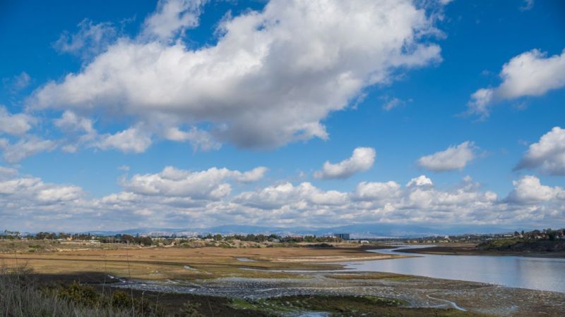 Outdoors with clouds and water