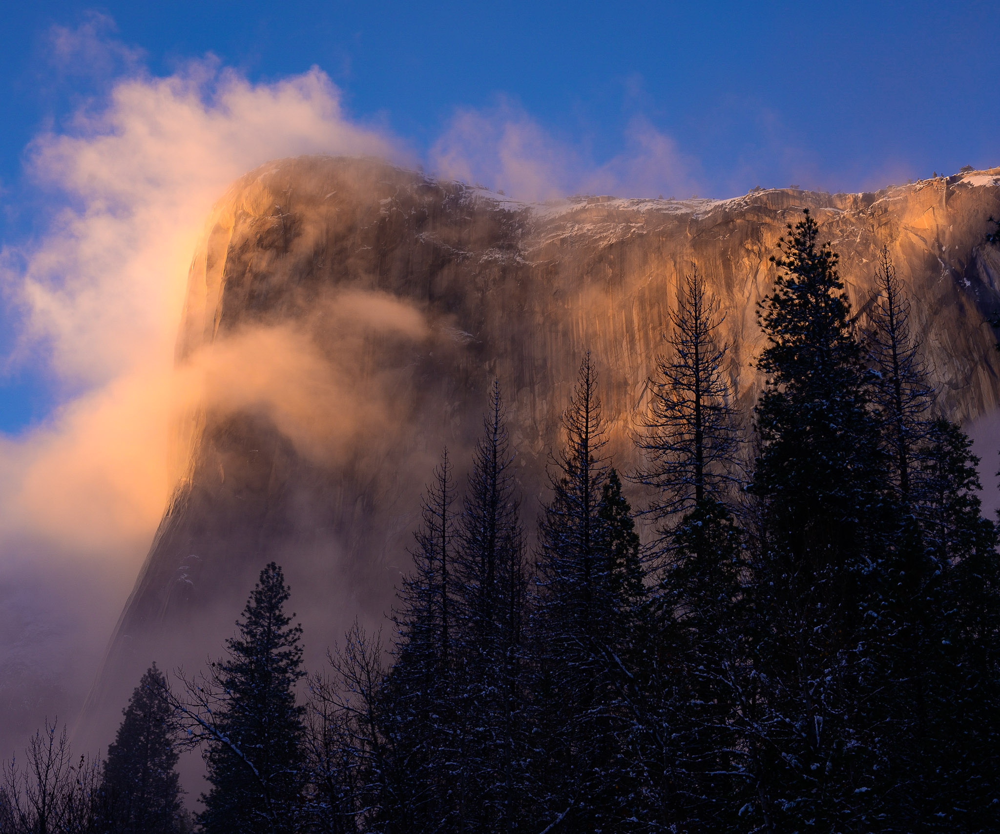 Dramatic winter storm clearing over mountain landscape