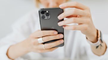 print from iphone hands holding phone