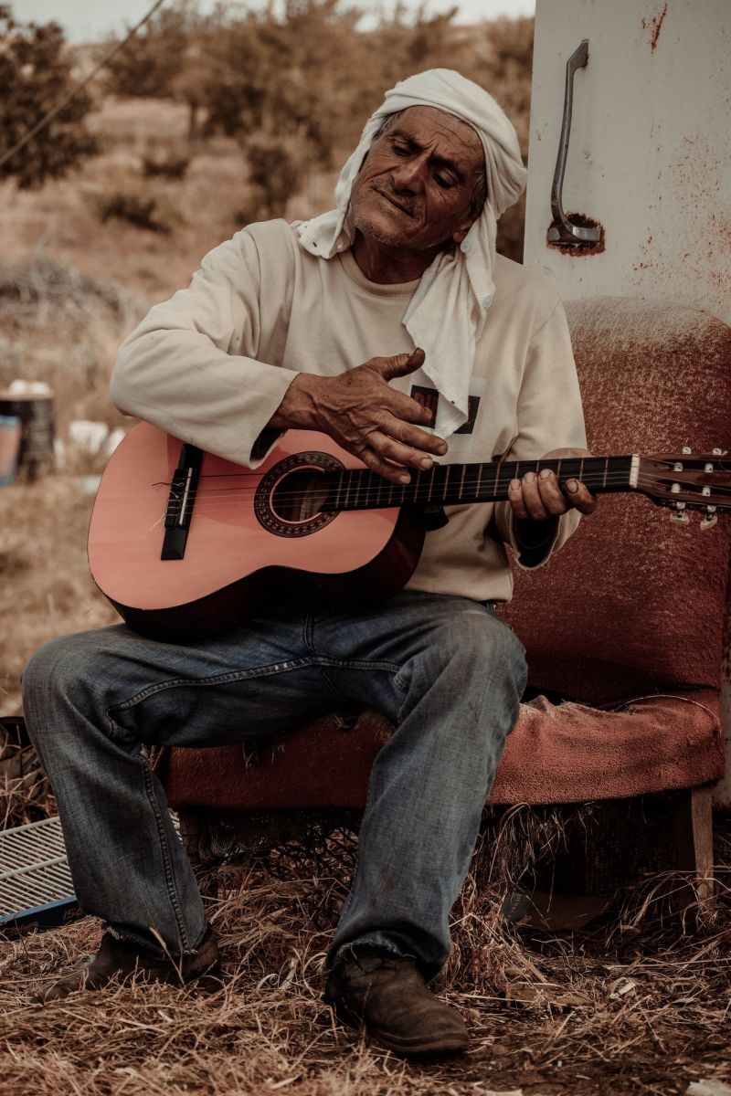 man playing guitar pexels roudy salameh