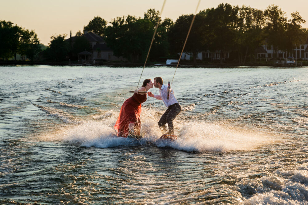 Couple waterskis together for lake wedding photography