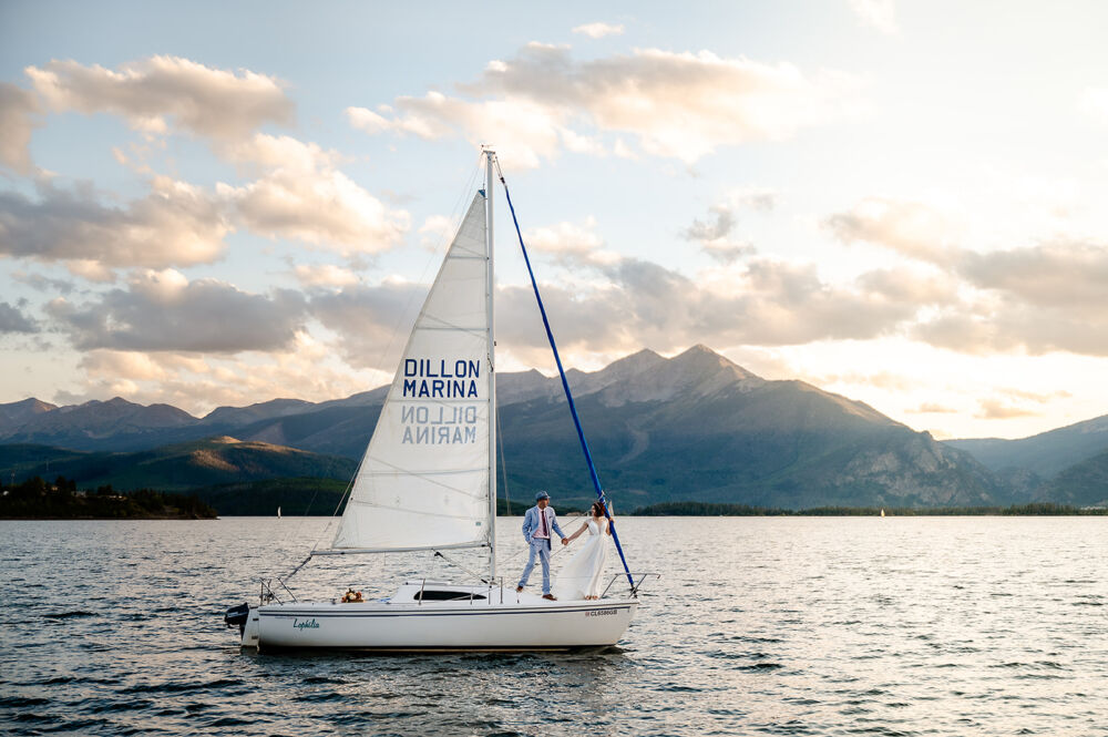 couple using a boat for lake wedding photography