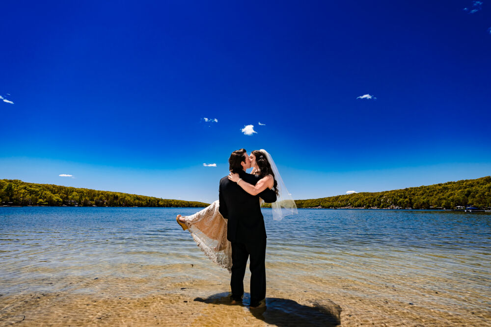 couple stands in the water