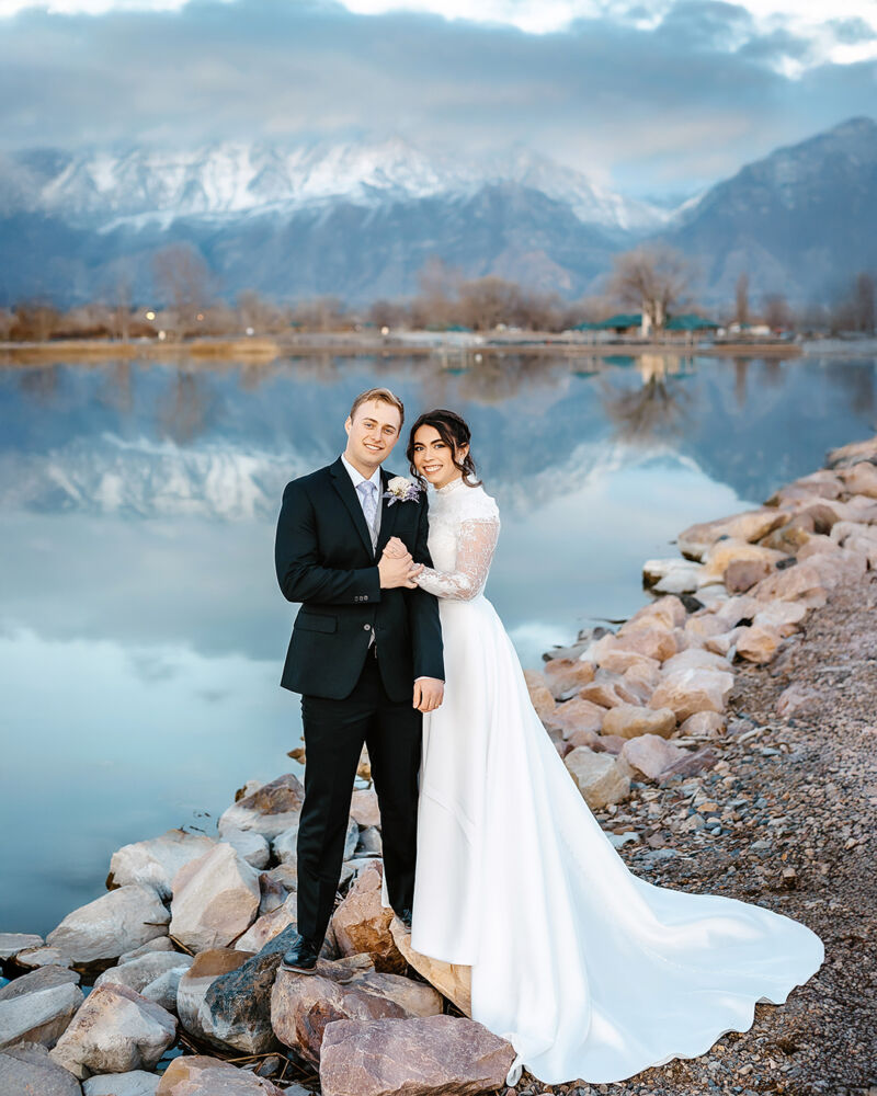 lake wedding photography couple on the shorline