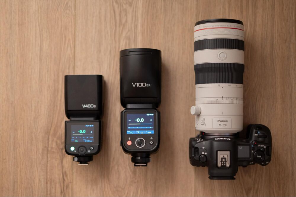 Flashes next to camera and lens for size comparison in Godox V480 Review