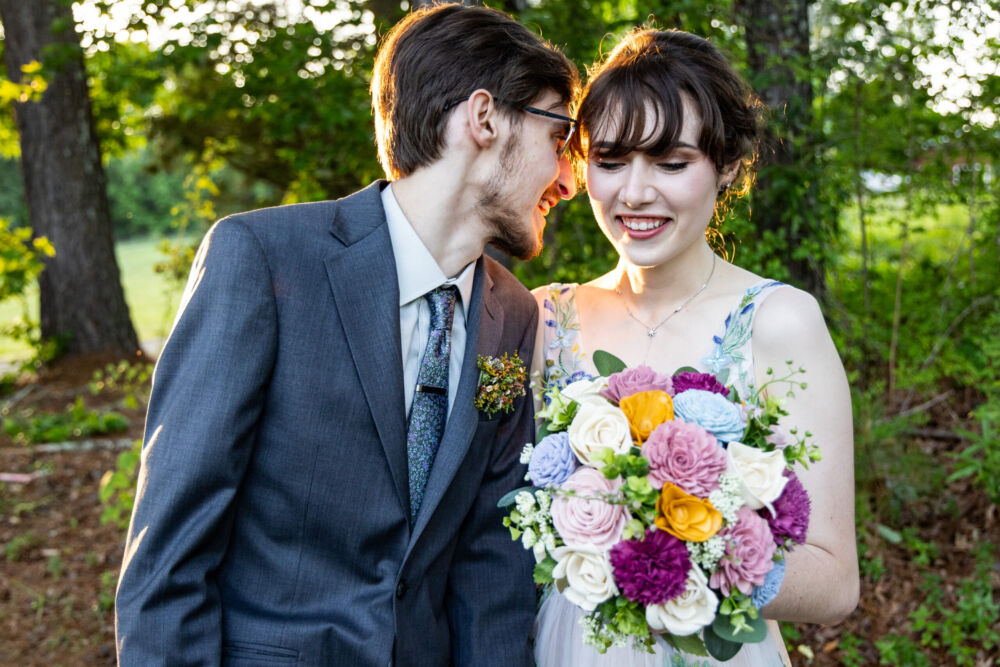 Groom leans in to chat with bride for rustic boho weddings